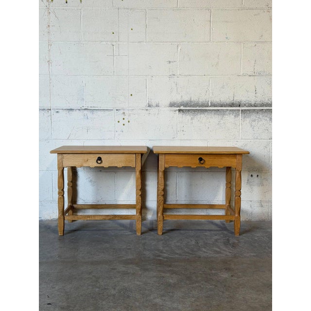 Graceful turned spindle legs support a clean top with a single drawer and lower cross stretchers. Each piece showcases...