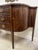 A vintage flame mahogany Drexel sideboard with beautiful inlaid detailing on all four legs, serpentine sides, six drawers...