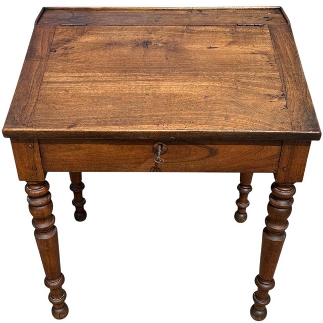 Magnificent Louis Philippe walnut writing desk from the 19th century. The top lifts up to store items and documents. There...