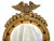 On offer is an elegant gilt wood "bullseye" convex mirror, which expresses a classic American Federal period aesthetic...