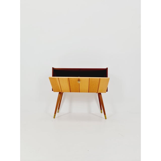German mid-century teak and ash wood small sideboard/side table, 1950s. Dimensions: 28 D x 65 W x 60 H cm. It is in good...