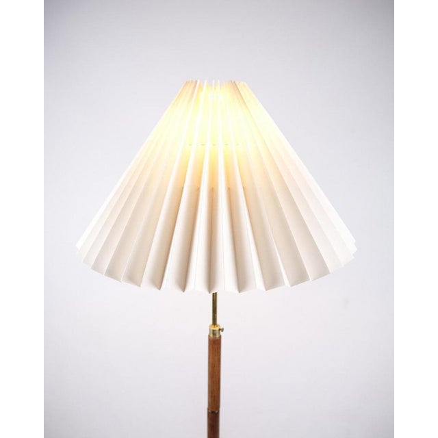 Danish floor lamp from the 1960s in teak with pleated shade. Classic design. — Designer: Dansk Design — Period: 1960s —...