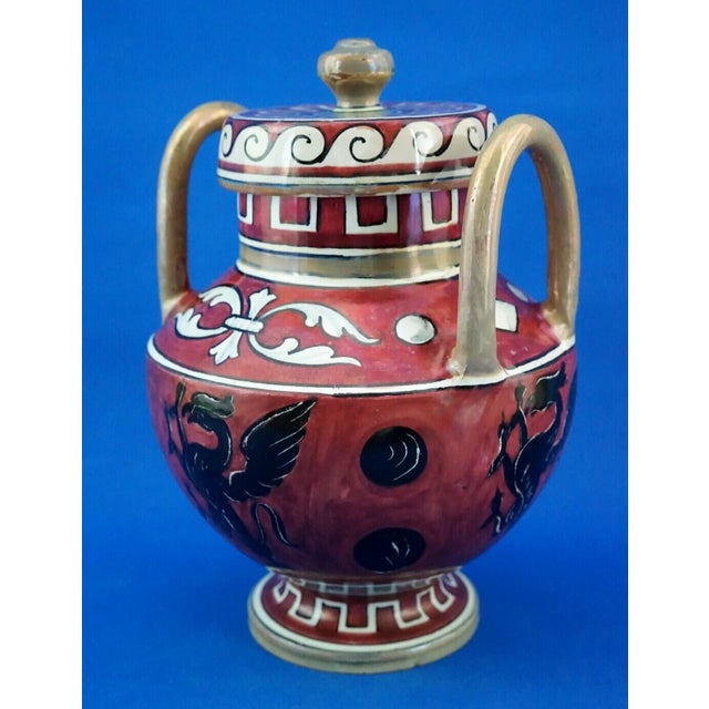 A stunning two-handled majolica potiche vase, glazed, vitrified, and entirely hand-decorated, finished with a metallic...