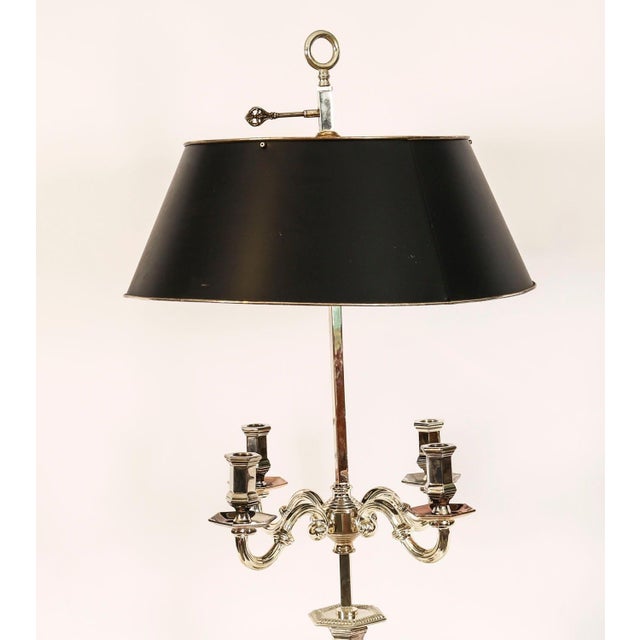 This is a splendid antique Victorian revival silver plated candleabra table lamp with rise and fall tole Bouillotte shade,...