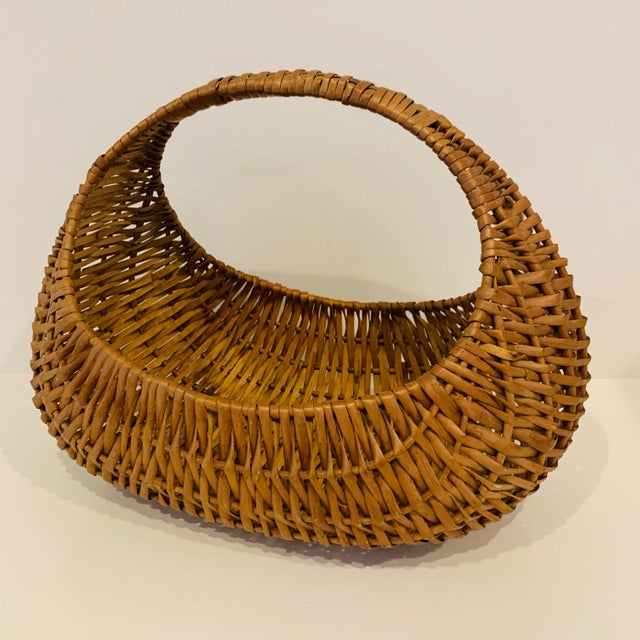 Vintage woven market basket Measures roughly 16" long x 10" wide x 12" high