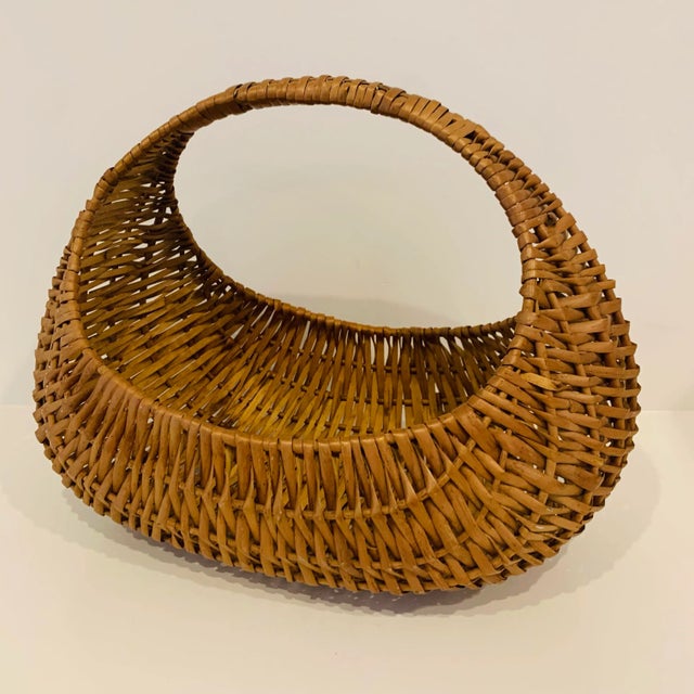 Vintage woven market basket Measures roughly 16" long x 10" wide x 12" high