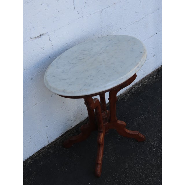 This gorgeous Side Table is made out of wood, solid wood, walnut, and marble. The End Table has Victorian Eastlake style...