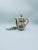 This Italian teapot is crafted from high-quality porcelain. Featuring a fitted lid, a curved spout, and a delicately...