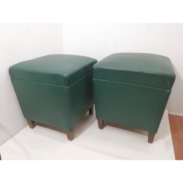 Pair of footrests, poufs, or stools made in the style of Gaetano Borsani. Original Sky fabric cover. Beautiful emerald...