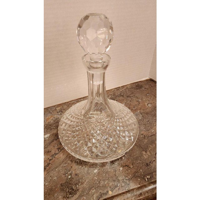Vintage clear glass decanter with spherical topper