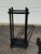 Black Umbrella or Walking Stick Stand With Removable Drip Tray. Has a worn look where the brown wood shows on the edges....