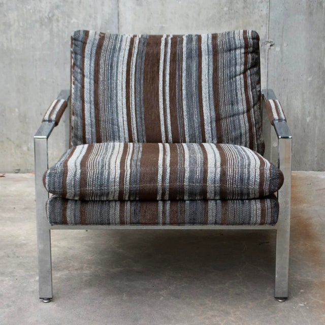 This fabulous vintage Mid-Century Modern lounge chair, designed by Milo Baughman for Thayer Coggin features a heavy chrome...