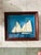 This charming vintage nautical shadowbox features a handcrafted three-dimensional sailing scene depicting two schooners...