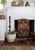 This English Arts and Crafts-style fireplace screen is upholstered in a burlap-like fabric with a tapestry look and...