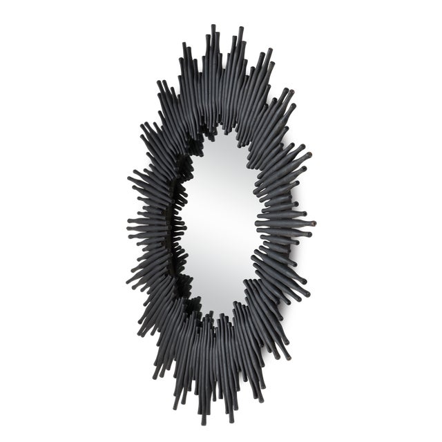 With a shape that celebrates the classic sunburst mirror, the Chadee Black Mirror offers a twist on the tried-and-true...