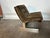 Italian mid-century lounge chair with a low, relaxed profile and deeply tufted seat and backrest supported by a minimalist...