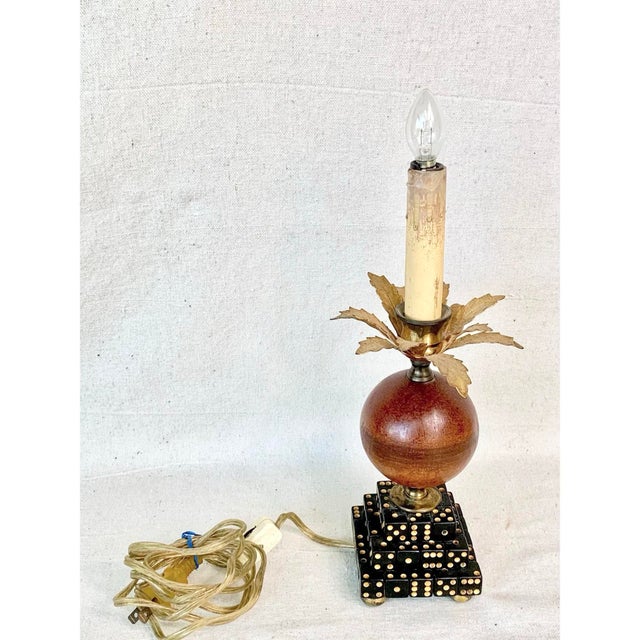 Bring a touch of whimsical sophistication and curated charm to your space with this unusual vintage Hollywood Regency...