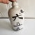 A heavy stoneware saki bottle. Inscribed with the name of the owner. Very rustic with pops n bubbles to the glaze