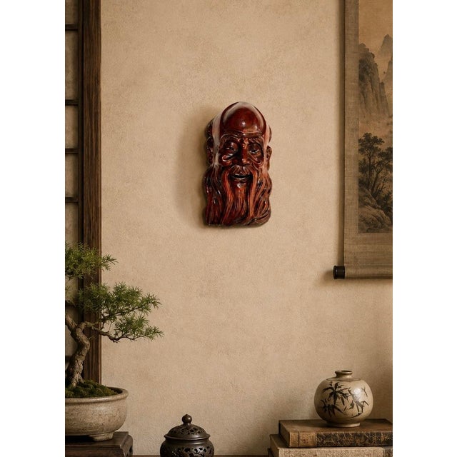 A wonderfully expressive late-20th-century Chinese wood carving depicting Shou Lao, or Shouxing, the traditional Chinese...