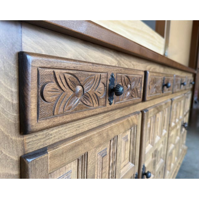 From Northern Spain, constructed of solid light walnut, the rectangular top with molded edge atop a conforming case...