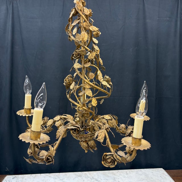 Museum quality antique French chandelier, rewired to American standards. Five scrolling arms, shaped as leafy vines,...