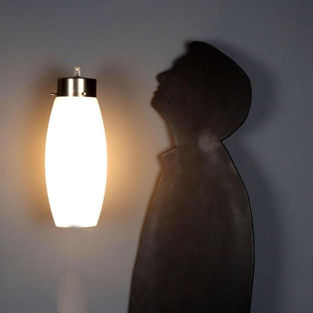 Wall lamp produced by Stilnovo in the 1960s, featuring an elegant and functional design. The mount is made of aluminum...