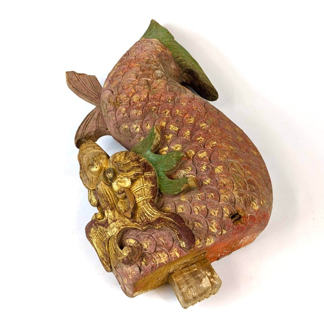 Hand carved wooden temple dragon in red lacquer and gold gild.