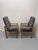 A stylish pair of vintage Danish Modern high-back lounge chairs dating to the 1970s, featuring striking, elongated...