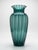 This striking piece features a graceful, elongated amphora form in rich teal-green glass with bold vertical white/clear...