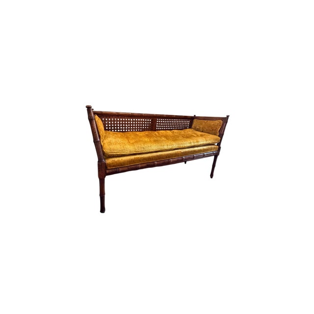 This bench/settee has a cane back and cane side panels with a walnut tone glaze over solid wood with speckled patina -...