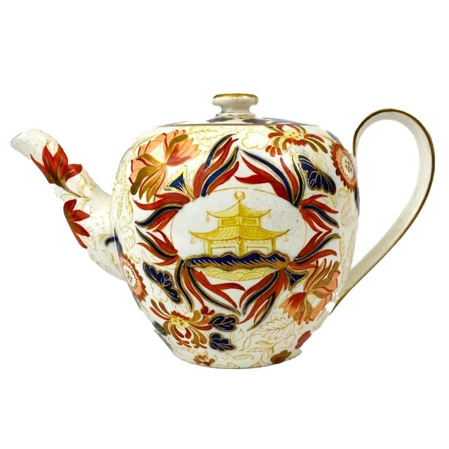 English Porcelain Chinoiserie Imari Teapot with Pagoda Reserves, 19th Century A little teapot with a lot of personality....