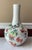 Celebrate the artistry and auspicious symbolism of traditional Chinese porcelain with this elegant Famille-Rose vase,...