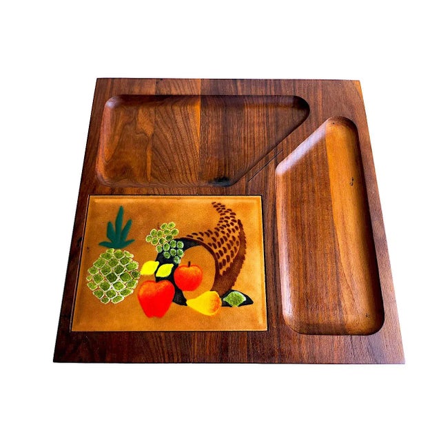 Offered is a square charcuterie board in walnut wood with a hand painted fruit vignette on a copper tile, designed by...