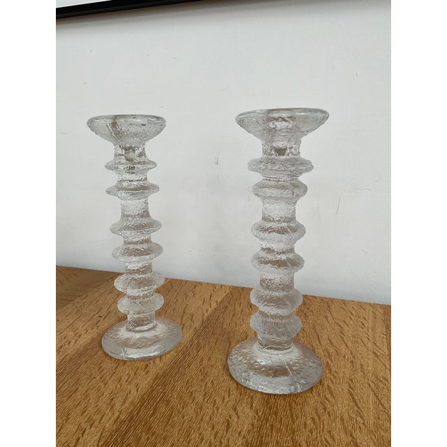 Elevate your tabletop or mantel with this iconic pair of vintage "Festivo" glass candlesticks, designed in 1966 by the...