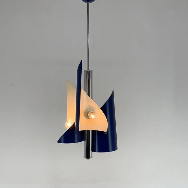Beautiful vintage asymetrical chandelier / pendant from Italy. Produced in the 1970's. Made of chrome and lacquered metal...