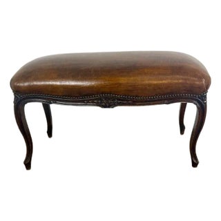French Louis XV Style Carved Bench With Distressed Leather Upholstery For Sale