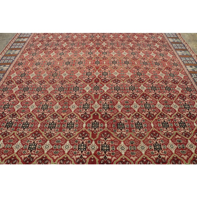 Made with hand-knotted wool and believed to originate from England in the late 19th century, this 11x12 antique Axminster...