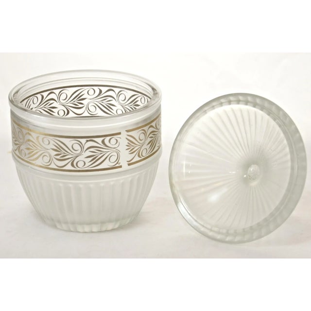 Vintage fluted frost glass dome lid bowl accented by a gold scroll and an ornate finial handle. No maker's mark. Light wear.