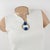 This stylish Mid-Century Modern Space-Age collar necklace has a geometric pendant. The silvered metal rigid neckband is...