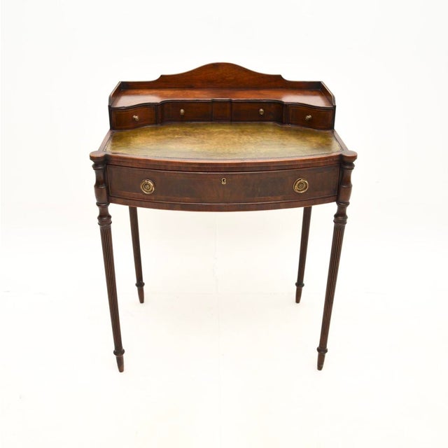 A wonderful antique Sheraton style escritoire desk. This was made in England, it dates from around the 1910 period. This...