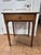 A 19th century country Sheraton side table in pine, with the ring-turned, tapering legs typical of the style. The two-...