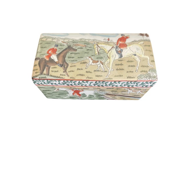 This is a decorative ceramic box featuring a vintage hand-painted illustration of a fox hunting scene. Depicting riders in...
