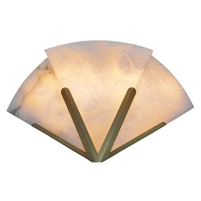 Art Deco style wall sconce made of Alabaster stone and gold coloured metal structure. Manufactured in the 1990's by the...