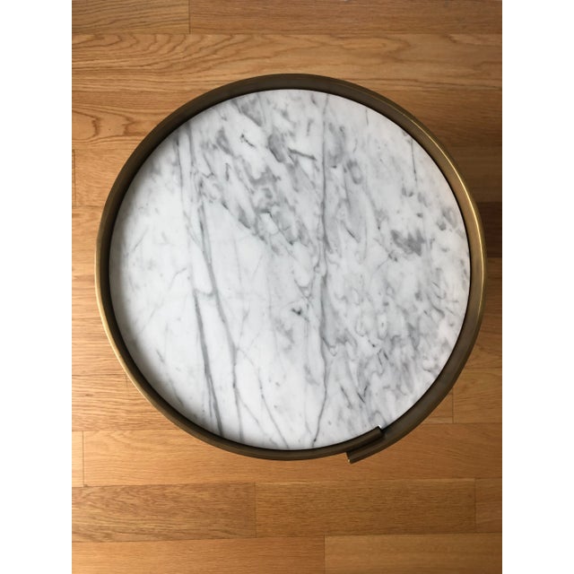 Alta side table by Celebrity LA Designer Kelly Wearstler, composed of 1/8” thick bronze-finished brass and honed White...