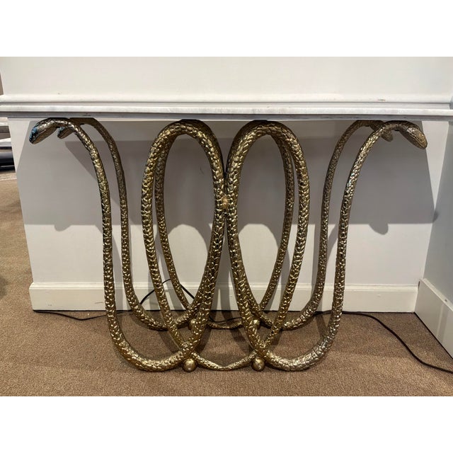Stylish Console, Gold Snake silhouette body, White marble top. Original Retail 1664. Showroom floor sample.