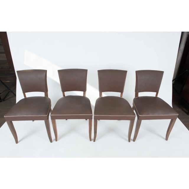Mid-Century Modern French dining chairs, in original brown vinyl. Frames are all recently tightened.