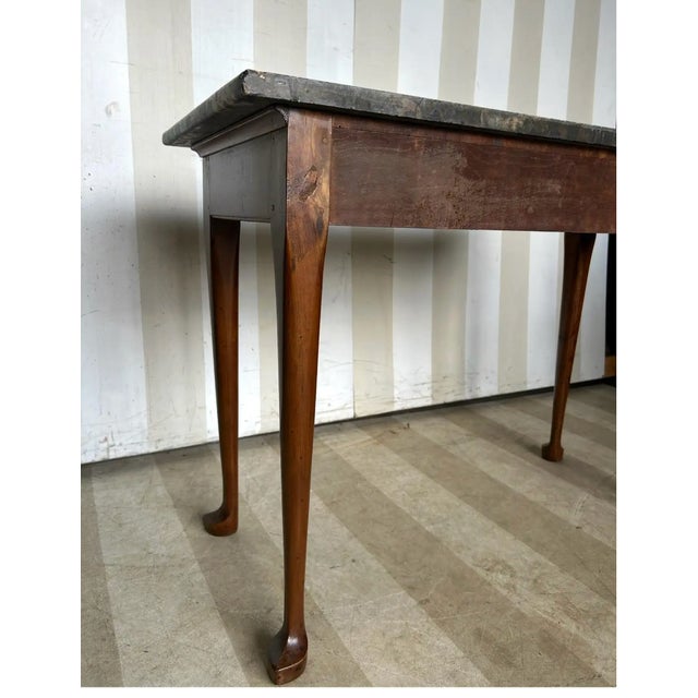 Fine and rare early 19th century American federal Period cherry and marble slab table with delicate slipper feet. Possibly...