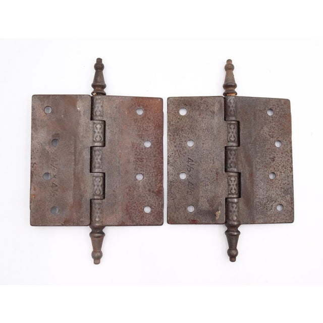 Victorian style door hinges made of cast iron with steeple tips, five knuckles, and a staggered hole pattern. The original...