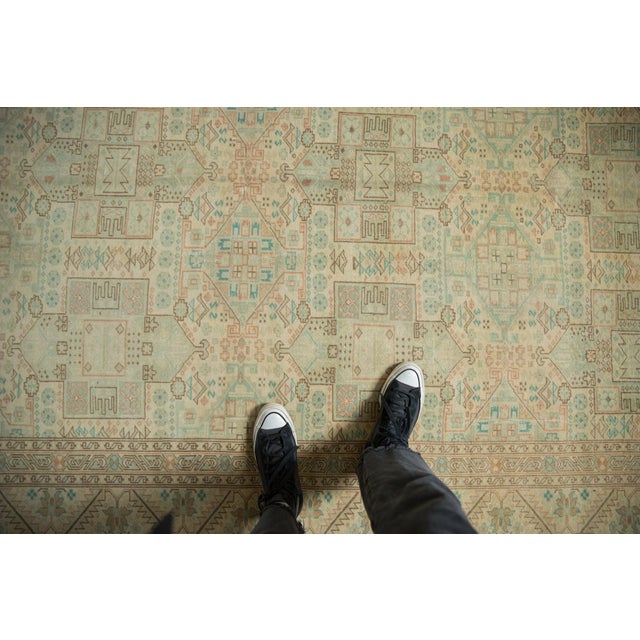 :: Allover covered field in geometric repeating shield medallion design motif arranged in three columns atop a covered...