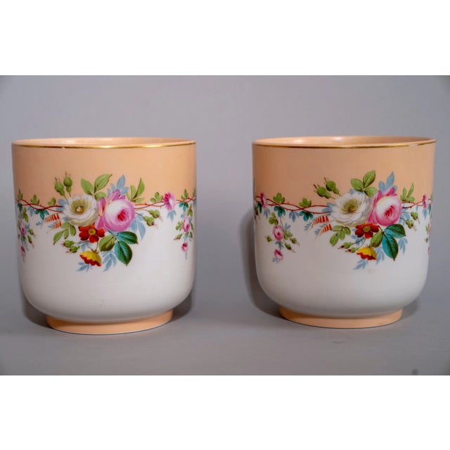 Pair of Mid 20th Century French Porcelain Pots. Carefully detailed hand-painted flower and vine detailing that separate...